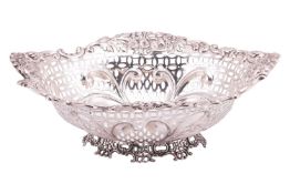 An Edwardian silver basket, London 1902, by Charles Boyton III, of shaped oval form with floral deco