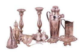 Two silver pierced bon bon dishes, a pair of silver pepperettes, a silver sugar caster, a silver sau