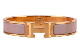 A Clic H bracelet with light brown/cream enamel by Hermés - Made in France, signed 'HERMÉS' total we