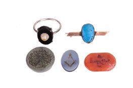 A collection of mixed jewellery items including a scarab beetle brooch in yellow metal tested as 14c