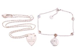 Gucci - a silver necklace and bracelet; the heart pendant attached to a fine cable link chain of 48.