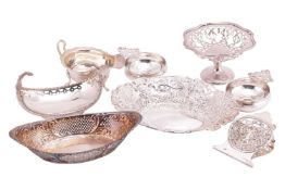 Four assorted small silver baskets, the largest 22.5 cm wide, together with a silver sauce boat, a p