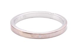 A diamond ring, set with a single round brilliant cut diamond to a plain square section band, ring s