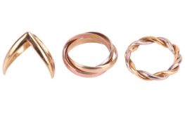Three rings; to include a triple rolling ring, tri-coloured metal marked 'Italy 585', size J½; a che