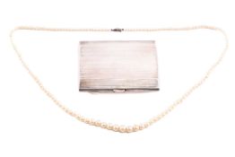 A silver cigarette case of rectangular form, measuring approximately 8.2mm x 6.8mm, Birmingham, 1933