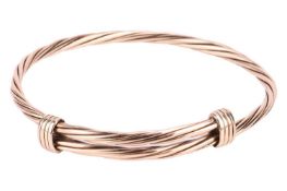 A 9ct yellow gold elephant hair adjustable bangle of twisted rope design, inner diameter measuring 6