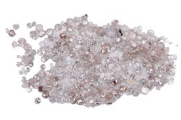 5.20ct melee parcel of loose rose-cut diamonds and diamond chips. Scanned with ultraviolet light for
