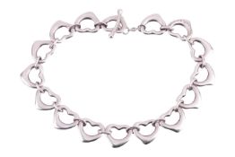 A Tiffany & Co - Elsa Peretti silver heart link bracelet measuring approximately 18.5cm, with ma