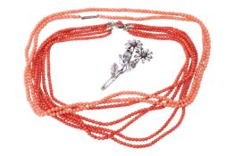Two coral necklaces comprising a five-strand beaded coral necklace, measuring approximately 43cm, wi