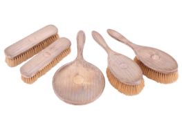 Walker & Hall, a silver-backed five-piece dressing table set comprising a hand mirror, two hair 