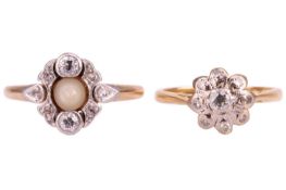 An Edwardian diamond daisy ring, the daisy head centrally set with an old-cut diamond, surrounded by