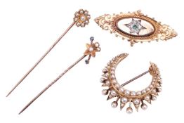 A collection of two brooches and two stickpins; comprising a Victorian seed pearl crescent brooch me
