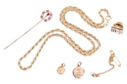 A collection of jewellery, including a ruby and diamond stick pin designed as a horseshoe measuring 