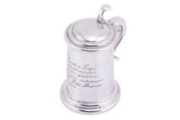 Dunhill:- A mid-20th century table lighter in the form of a tankard with a hinged cover, inscribed 