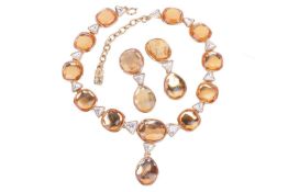 A Yves Saint Laurent paste set necklace and clip earrings suite, circa 1980s. The suite is set with 