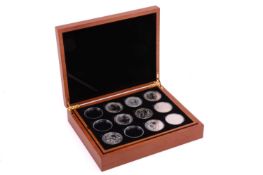 A collection of nineteen Royal Mint fine silver 1oz Britannia coins, all sealed and in a fitted pres