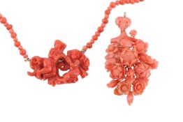 A carved coral beaded necklace and a floral spray pendant; the necklace comprising a carved coral pe