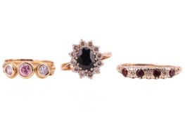 Three dress rings; comprising a 9ct gold garnet and diamond star-set ring in 9ct gold, size S 1/2; a