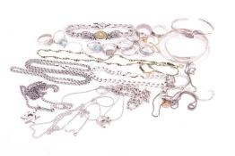 A collection of mixed jewellery items including a silver triple interlocking bangle, a stylised silv