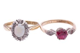 Two gem-set rings; comprising an opal and diamond set oval cluster ring in an 18ct bi-colour gold mo