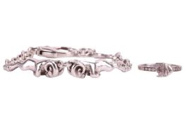 A Theo Fennell Alias Ram Beastie silver bracelet, featuring two central ram figures to a cable chain