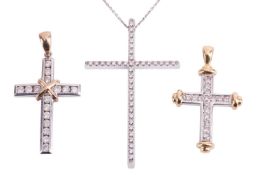 Three diamond crosses; comprising a cross pendant set throughout with 1mm round brilliant cut diamon