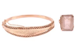 A hinged bracelet and a large smoky quartz cocktail ring; the bracelet with a tapered band with flor