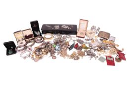 A large quantity of costume jewellery, including brooches, necklaces, bracelets and bangles in white