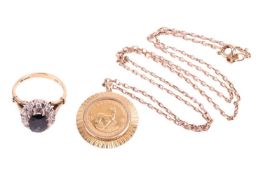 A sapphire and diamond cluster ring and a 1/10 Krugerrand pendant on chain; the ring centred with an