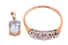 A five-stone diamond ring, claw set with graduated round brilliant diamonds in a white metal mount, 