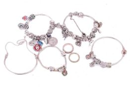 A collection of Pandora jewellery comprising five bracelets with assorted charms and rondels togethe