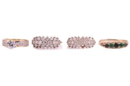 Four dress rings, all stamped '375'; comprising a half hoop five-stone emerald ring in a 9ct gold mo