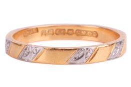 A 22ct yellow gold and platinum ring, the flat-shaped band measuring approximately 2.8mm wide, with 