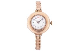 A lady's 9 carat gold wristwatch; of half hunting cased pocket watch design, with white enamel dial,