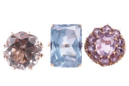 Three dress rings in 9ct gold, comprising an amethyst cluster ring with a textured gold mount with h