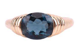 A London blue Topaz set ring, in yellow metal stamped 14k with a ring size P1/2. Total weight of ite