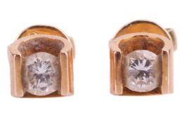 A pair of diamond stud earrings, the round brilliant diamonds measuring approximately 3.6mm each wit