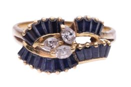 A sapphire and diamond dress ring, the three marquise-shaped diamonds centrally set and surrounded b