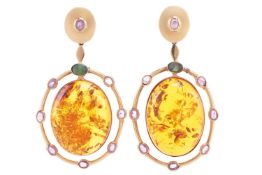 A pair of reconstituted amber, emerald and pink sapphire drop earrings, the bezel set oval amber cab