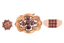 A collection of three items of jewellery, including a Victorian garnet brooch measuring 38 x 28mm, a