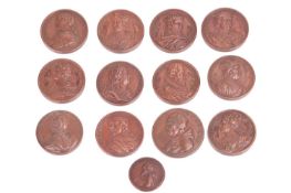 A collection of thirteen bronze medals, in high relief, including commemorative papal medals for St 