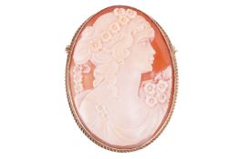 A shell cameo brooch featuring the profile of a lady, the gold mount with hallmarks for 9ct gold, me