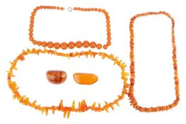 A collection of amber jewellery; comprising two brooches with pin fittings to the reverse, with one 