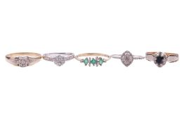A collection of five gem-set gold rings comprising a sapphire and diamond cluster ring in 9ct bi-col