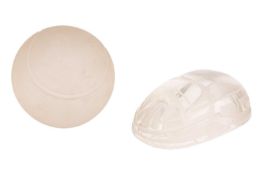 A pair of Tiffany & Co. glass paperweights, modeled as a scarab and frosted tennis ball, both si
