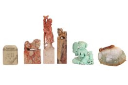 A Chinese mutton fat and green jade panel carved with a laughing Buddha, 6 cm long x 4.2 cm high, to