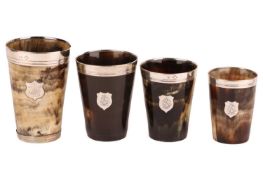 A collection of sterling silver mounted horn beakers, of graduated size, largest 12.5 cm tallDamage 
