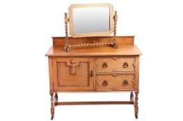 An Arts and Crafts restored oak sideboard, with two short drawers and a large single-shelved cupboar