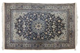 A navy ground Nain rug with a 