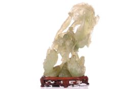 A Chinese carved green Jadeite figure of a courting Pheonix and Dragon, the second half of the 20th 